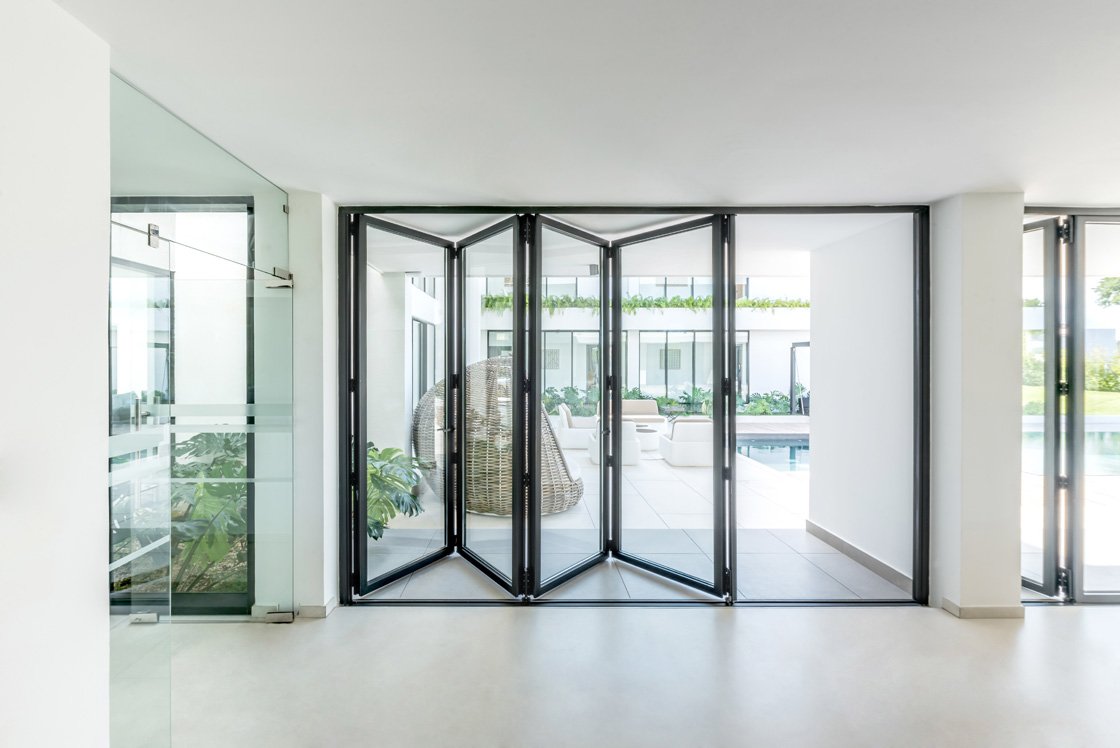 A bright architectural space featuring Glideline aluminium doors