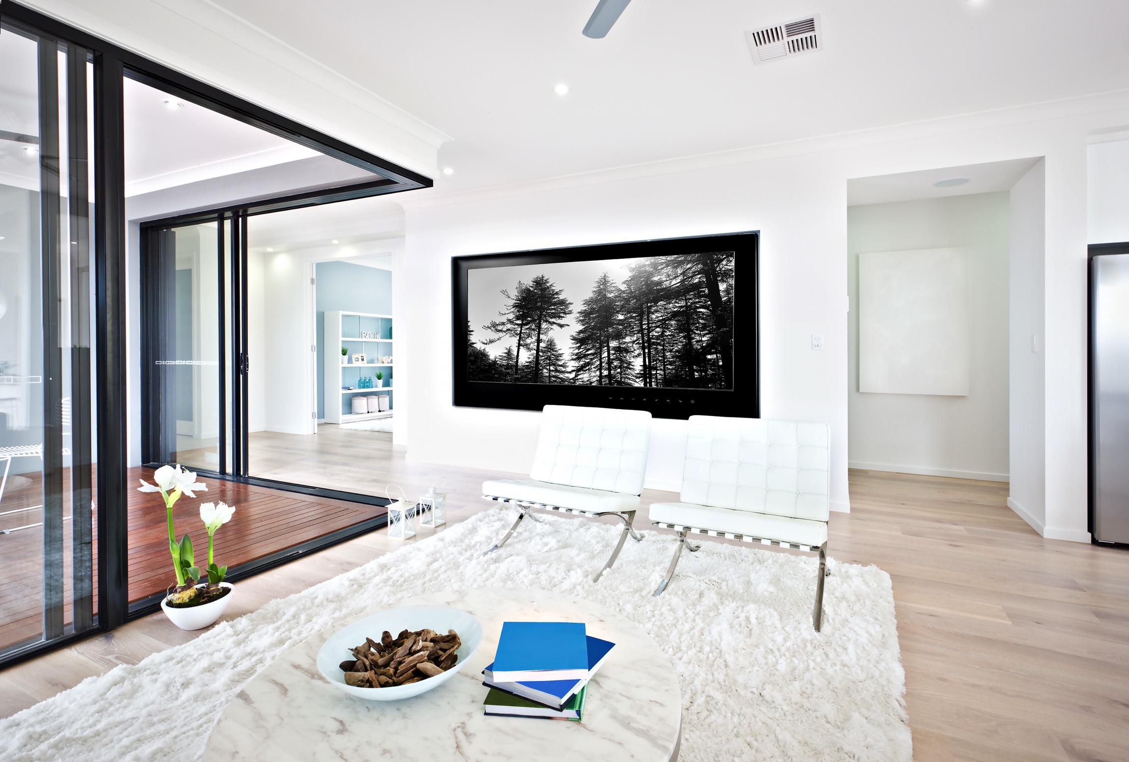 large modern room with sliding pocket doors to an external space